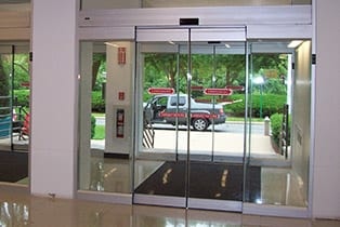Nabco all glass automatic sliding door interior lobby