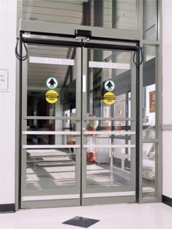 Automatic swing door with caution signage interior