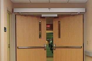 Fire door automatic operator hallway
